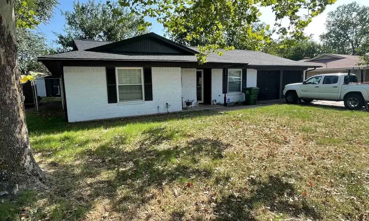 Professional roofing crew working on a residential roof in Snyder